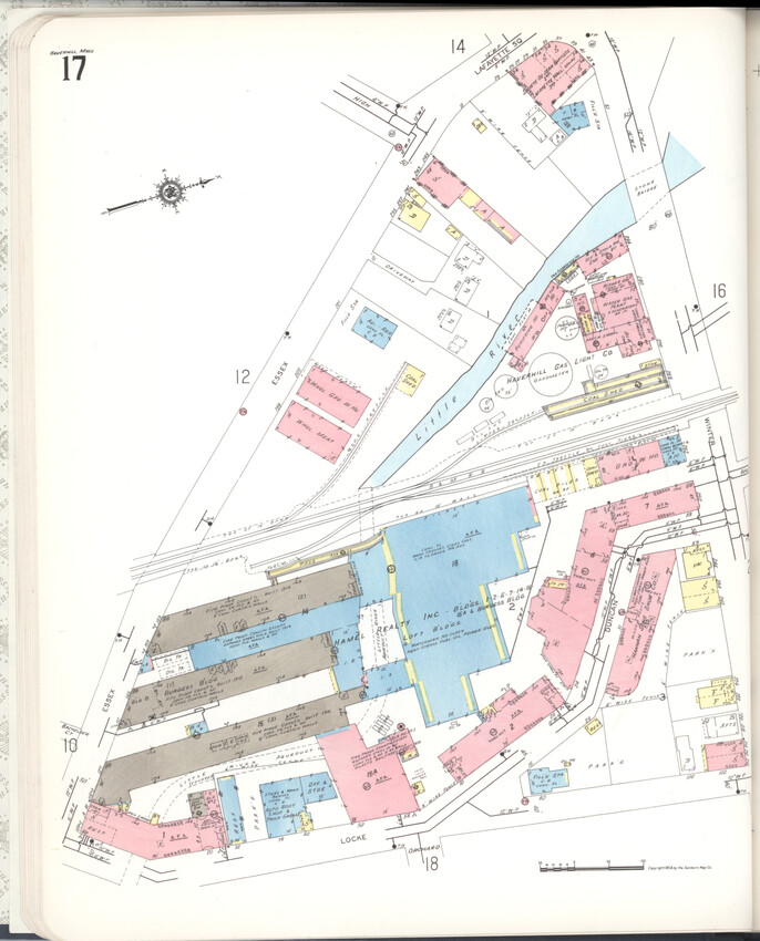 A multicolored map shows three long, parallel factory buildings at the lower left. The Little River comes from the top right and passes behind the three buildings, weaving through a range of other historic brick buildings.
